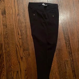 Black pants with gold decorative ball on pockets